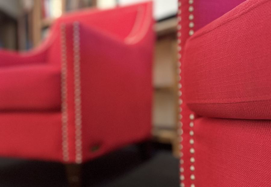 A pair of red armchairs facing each other